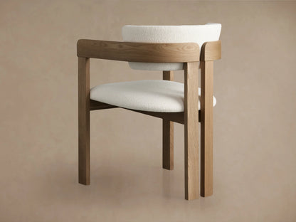Rodin Dining Arm Chair in Natural, featuring a curved ash wood backrest with soft, textured white fabric upholstery and elegant grain.