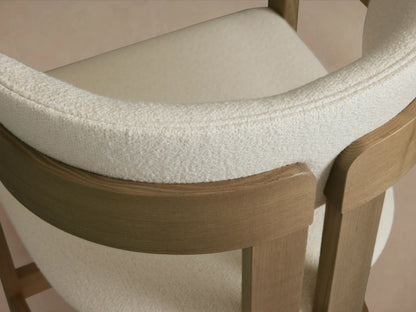 Natural ash wood Rodin Counter Stool with a light upholstered seat and backrest, featuring a sturdy wooden frame with side supports.