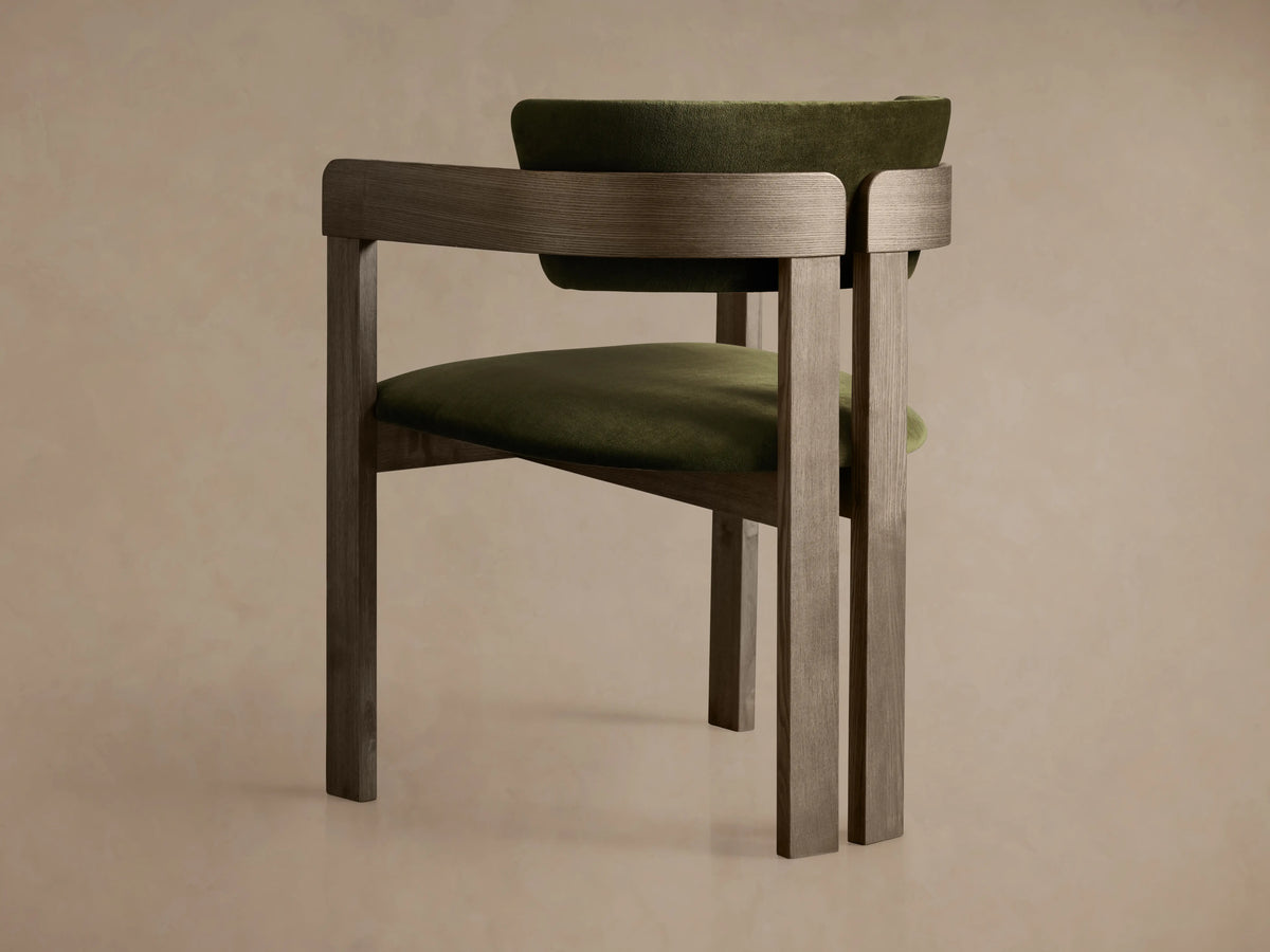 Rodin Dining Arm Chair in Vance Olive with ash wood frame, featuring cushioned back and seat in olive green fabric.