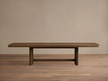 Top-down view of the natural wood finish extendable wooden dining table with rounded corners.