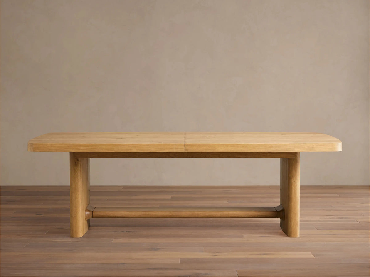 Natural light oak Redding Extension Dining Table. Rectangular top, rounded corners, sturdy block legs, visible extension seam.