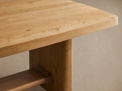 Light oak Redding Extension Dining Table, rectangular with rounded corners, visible center seam, sturdy legs on a wood floor.