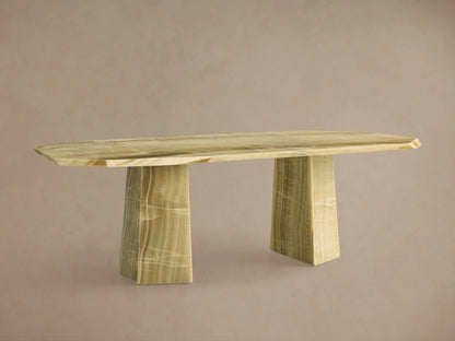Full view of the light green onyx Zyra Stone Dining Table with an octagonal top, chiseled edges, and two solid pedestal bases.