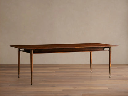 Ross Extension Dining Table in solid walnut wood with patina brass leg caps. Features a self-storing extension leaf and tapered legs.