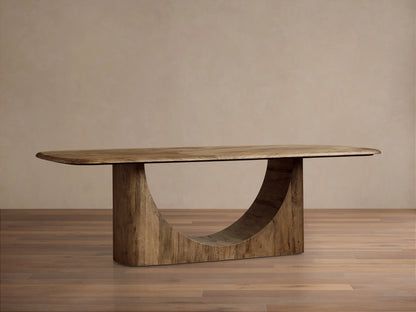 San Rafael Dining Table close-up showing curved, handcrafted primavera wood with visible grain, splits, and a semi-matte finish.