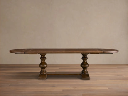 Front view of the brown Stefania Oval Extension Dining Table, with oval top featuring a botanical motif and hand-turned pedestal legs.