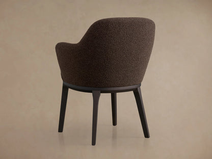 Simone Dining Arm Chair in textured brown upholstery, featuring curved armrests and a plushly padded seat with dark wood frame.