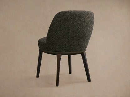 Dark grey flecked Simone Dining Side Chair with a curved upholstered back and seat, featuring dark wooden legs.