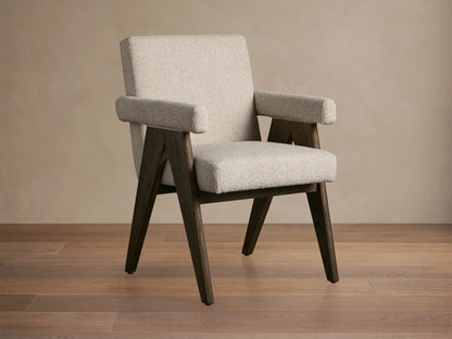 Stanley Dining Arm Chair in Mocha with oak wood frame and ecru fabric, angled view on wooden floor.