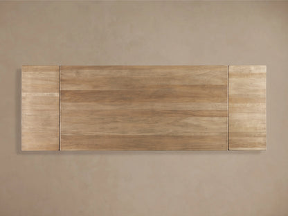 Tuscany Extension Dining Table made of poplar wood, showcasing hand-turned pedestal legs and a horizontal trestle on a wood floor.