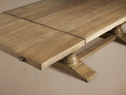 Tuscany Extension Dining Table made of warm poplar wood with two extended leaves, showing rich grain and antiqued finish.