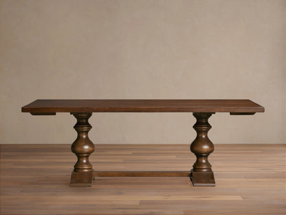 Tuscany Oval Extension Dining Table in dark wood, with an oval shape and hand-turned pedestal legs on a wooden floor.