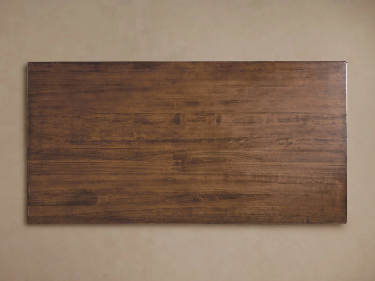 Tuscany Oval Extension Dining Table with warm, rich poplar wood finish, detailed pedestal legs, and lacquered surface.