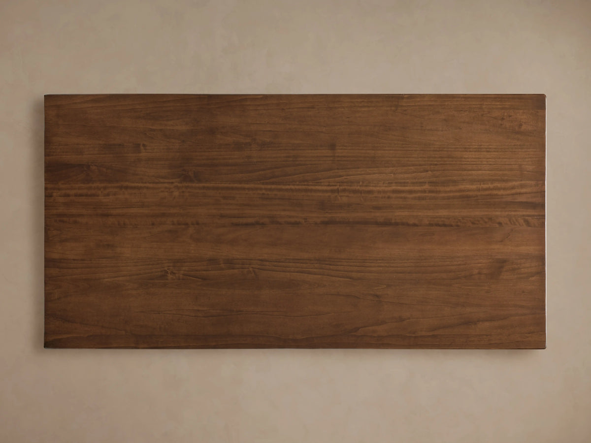 Tuscany Extension Dining Table corner close-up showing rich poplar wood grain, smooth surface, and lacquered finish.