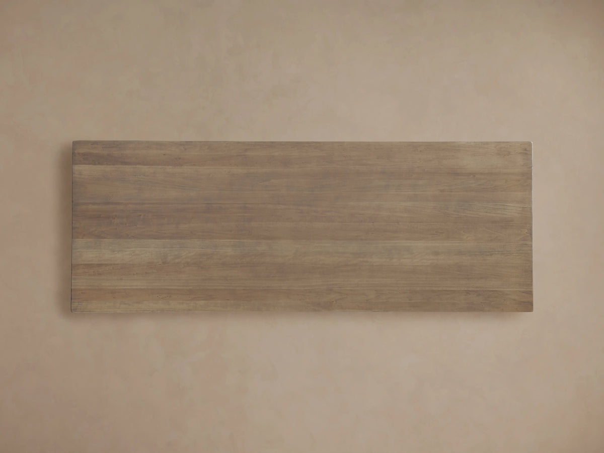 Oval Tuscany dining table detail, showcasing solid poplar wood with visible grain and an antiqued, distressed finish.