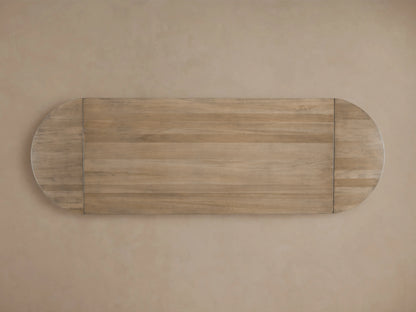 Oval extension dining table top with a warm, rich wood grain finish. Displayed against a muted background.