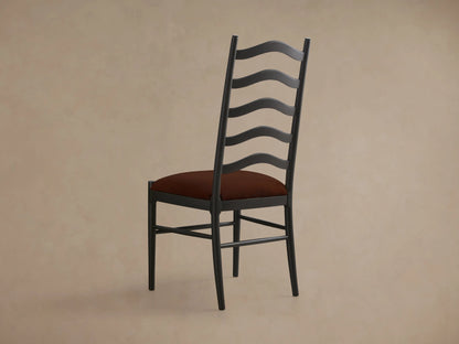Front view of a dark gray Vivianna Dining Side Chair with a ladder-back design featuring wavy slats and a rust upholstered seat.