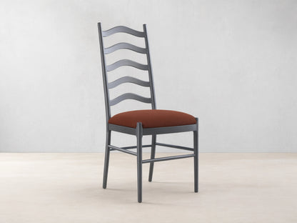 Front view of the black Vivianna Dining Side Chair with a wavy ladder-back and a brown padded seat.