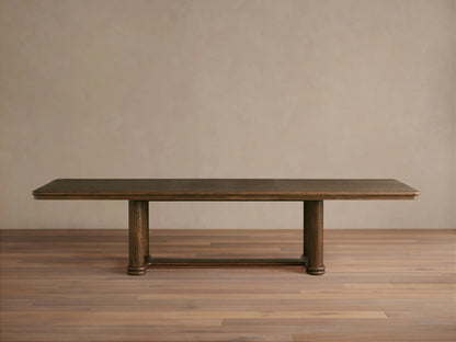 Close-up view of the substantial mocha Warby Extension Dining Table, crafted from solid oak wood, with decorative items on top.