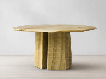 Front view of the green onyx Zyra Round Dining Table, featuring an asymmetrical top and a split pedestal-style base.