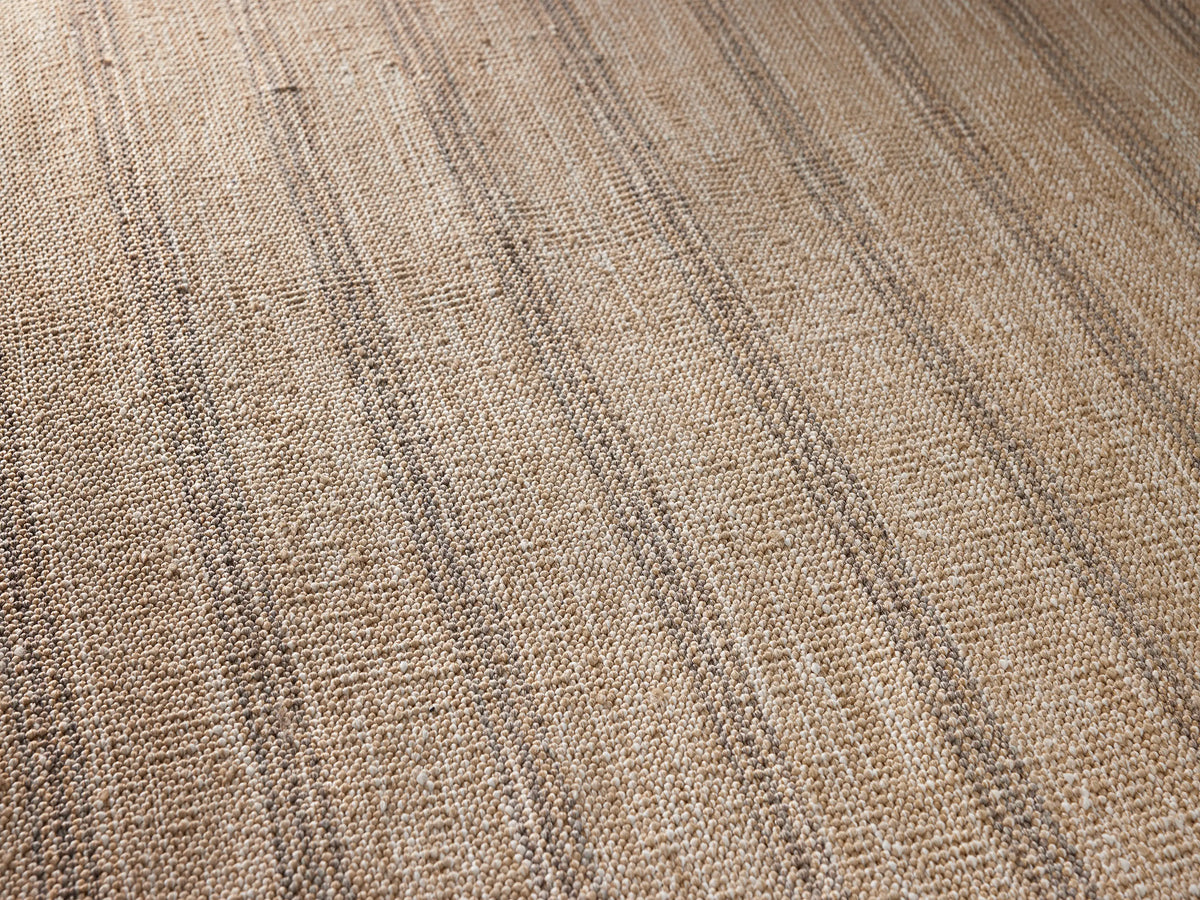 Grover Performance Rug, rectangular, light beige with vertical narrow dark gray stripes & solid dark gray borders on short sides.