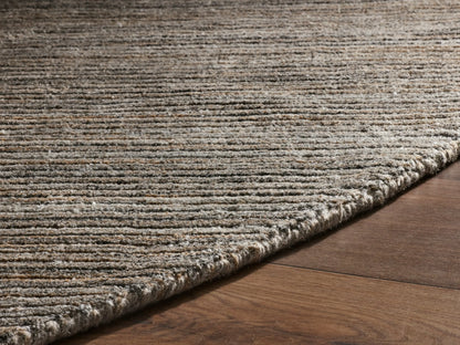Close-up of the mottled brown and gray flecked ribbed fabric texture with diagonal ridges.
