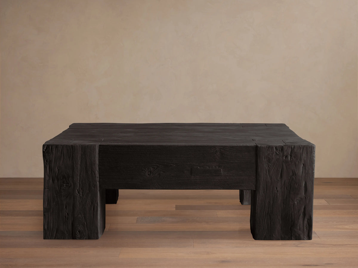 Ubud Square Coffee Table made of reclaimed teak wood with a deep black Shou Sugi Ban finish, exhibiting a textured, charred appearance.