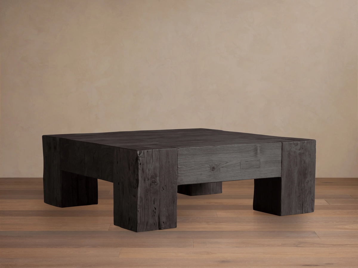 Ubud Square Coffee Table made of reclaimed teak wood with a deep black Shou Sugi Ban finish, exhibiting a textured, charred appearance.
