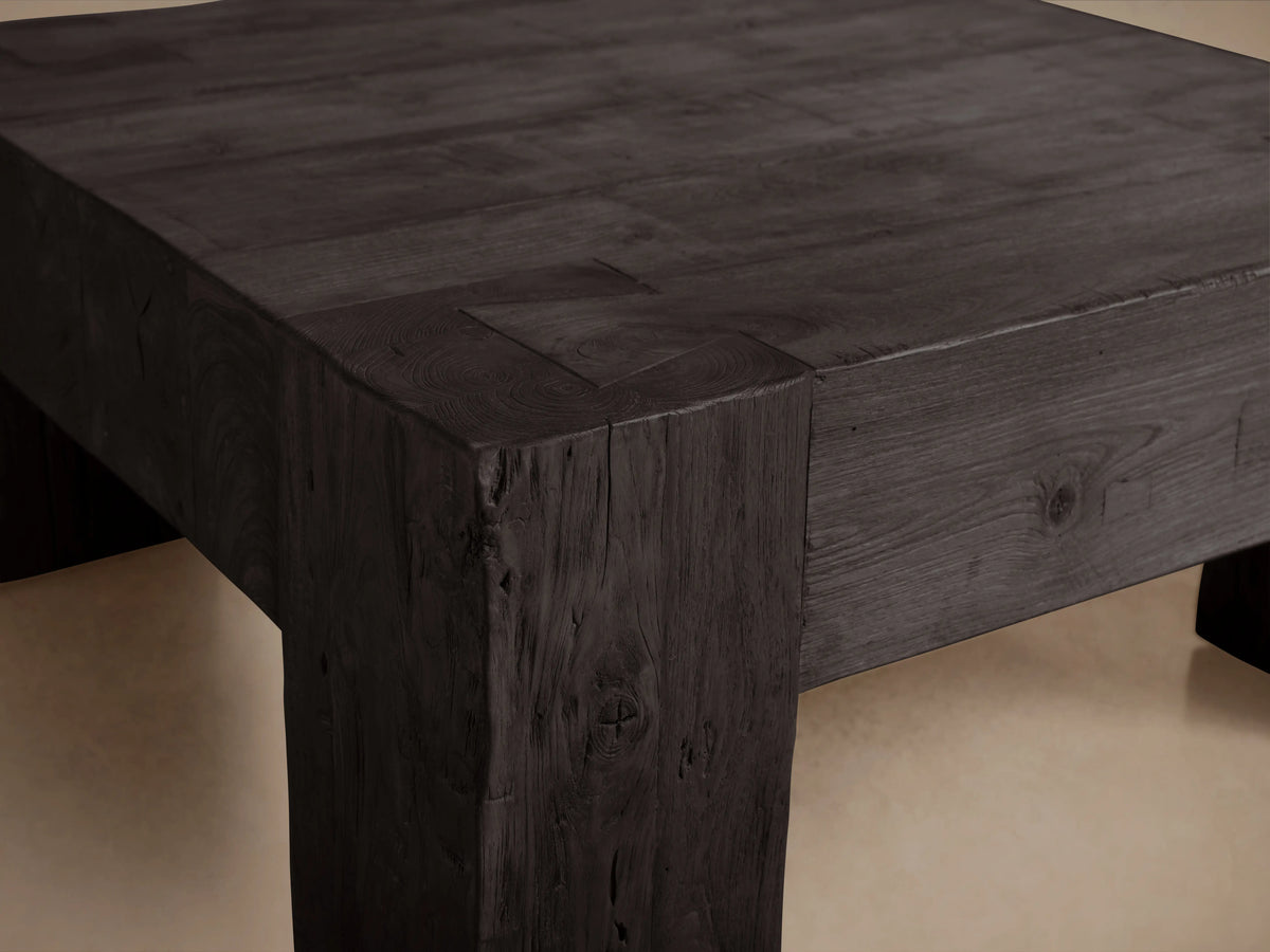 Square coffee table made from reclaimed teak wood with a rich, black Shou Sugi Ban finish, showcasing textured, charred appearance.