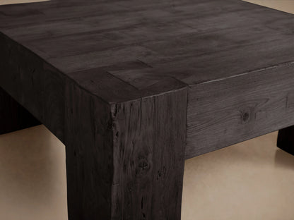 Square coffee table made from reclaimed teak wood with a rich, black Shou Sugi Ban finish, showcasing textured, charred appearance.