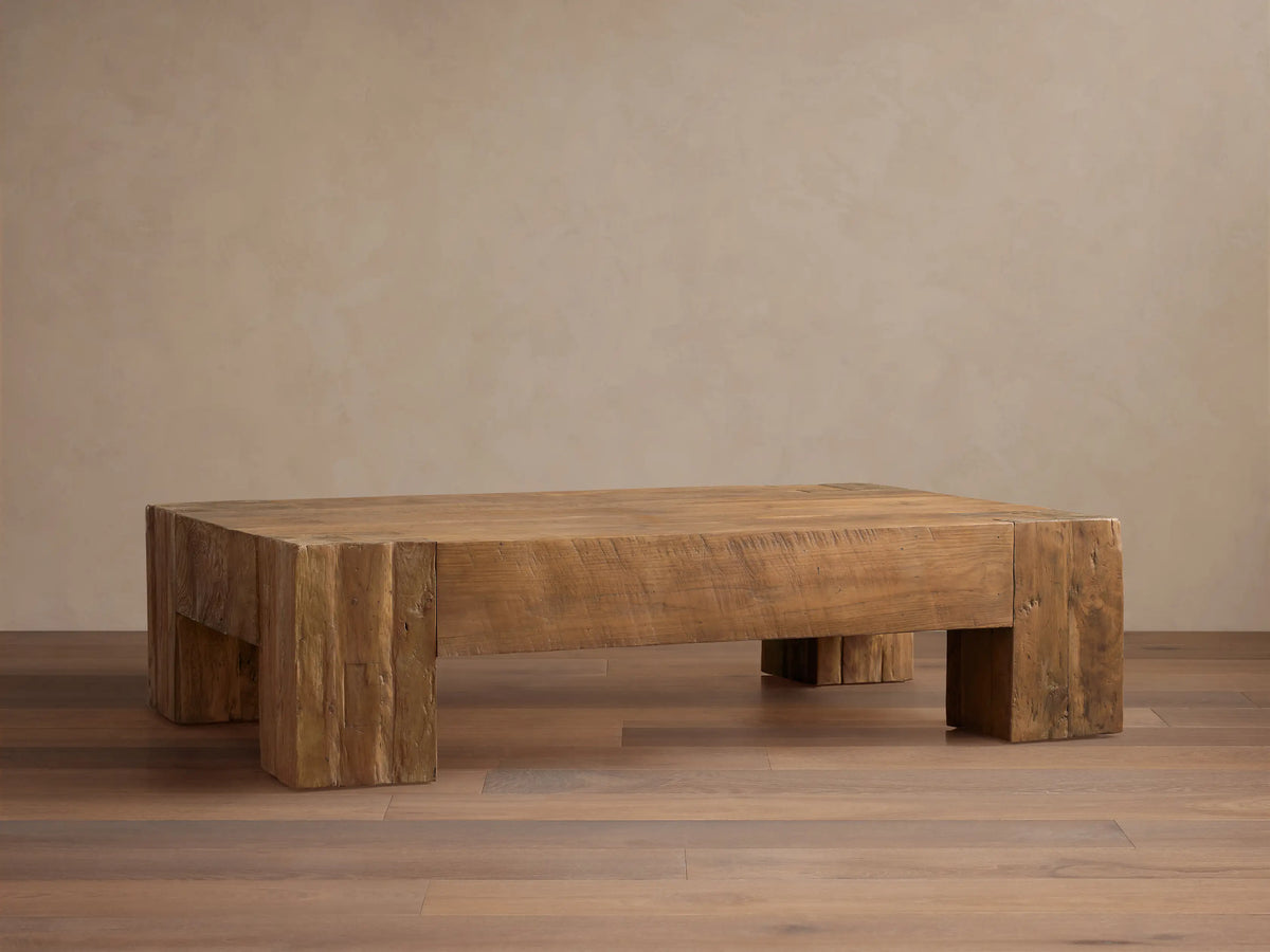 Ubud Coffee Table: low, rectangular, light brown reclaimed teak wood with visible grain, knots, and natural texture.
