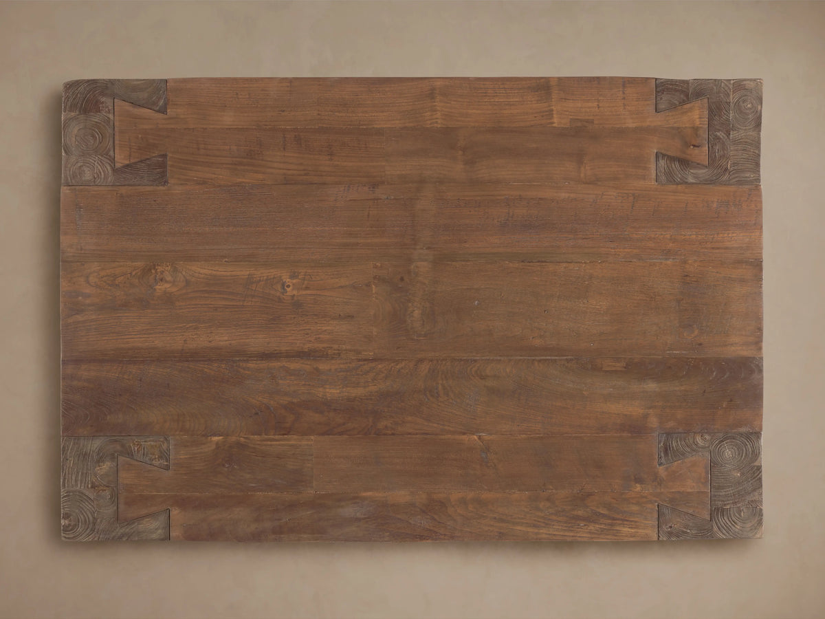 Angled close-up of Ubud Coffee Table corner, natural waxed reclaimed teak with prominent wood grain, knots, and robust joinery.