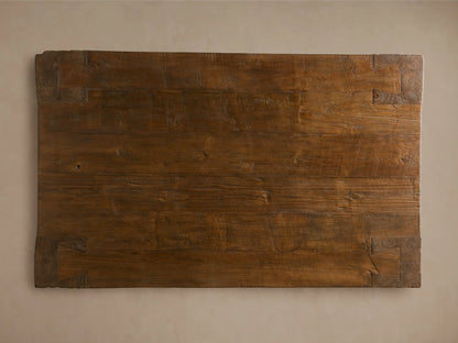 Close-up of Ubud Coffee Table corner, showing warm brown reclaimed teak wood with deeply textured leg and visible grain.