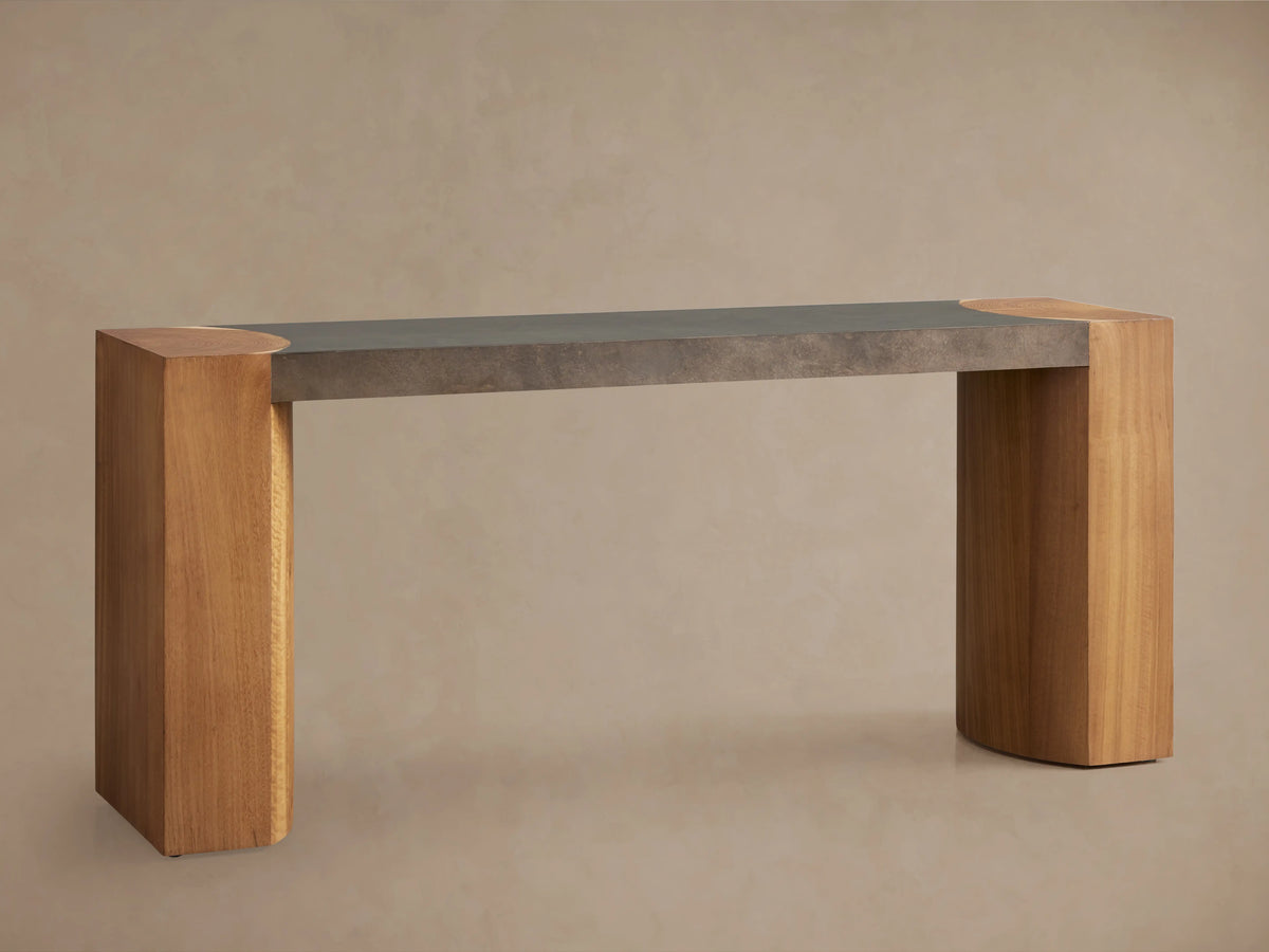 Acacius Console Table with a sleek, naturally oxidized steel top and sturdy wooden legs crafted from reclaimed yukas trees.