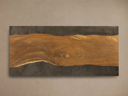 Angled view of Acacius Long Coffee Table, featuring dark oxidized steel and warm brown wood top with prominent natural growth rings.