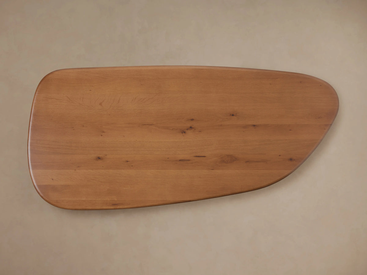 Akiro Coffee Table with rounded edges, made of solid oak wood, showing natural grain and smooth lacquer finish on top.