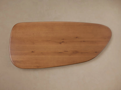 Akiro Coffee Table with rounded edges, made of solid oak wood, showing natural grain and smooth lacquer finish on top.