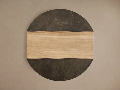 Front view of the Almeria Round Coffee Table, with a light brown guanacaste wood center and wavy dark gray oxidized steel edges.
