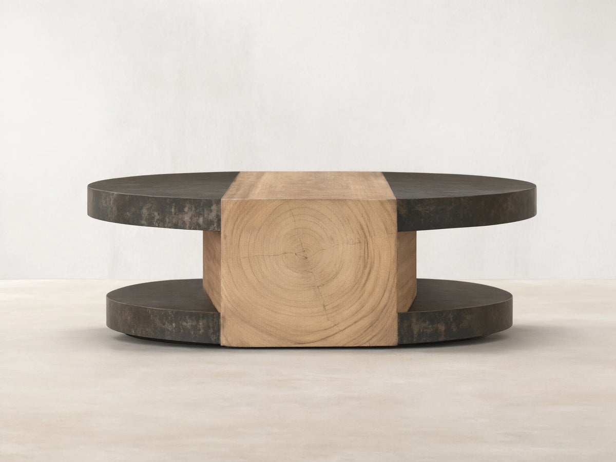 Front view of Almeria Round Coffee Table. Dark oxidized steel discs and angled guanacaste wood block with end grain.