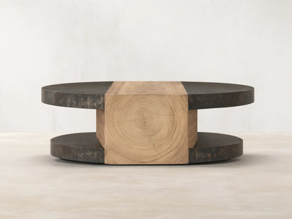 Front view of Almeria Round Coffee Table. Dark oxidized steel discs and angled guanacaste wood block with end grain.