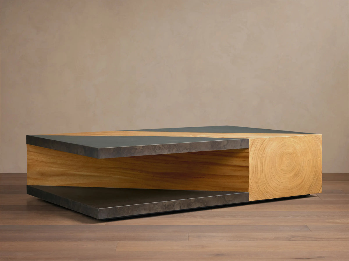 Front view of Almeria Coffee Table with dark oxidized steel top, diagonal guanacaste wood inlay, and wood block end.
