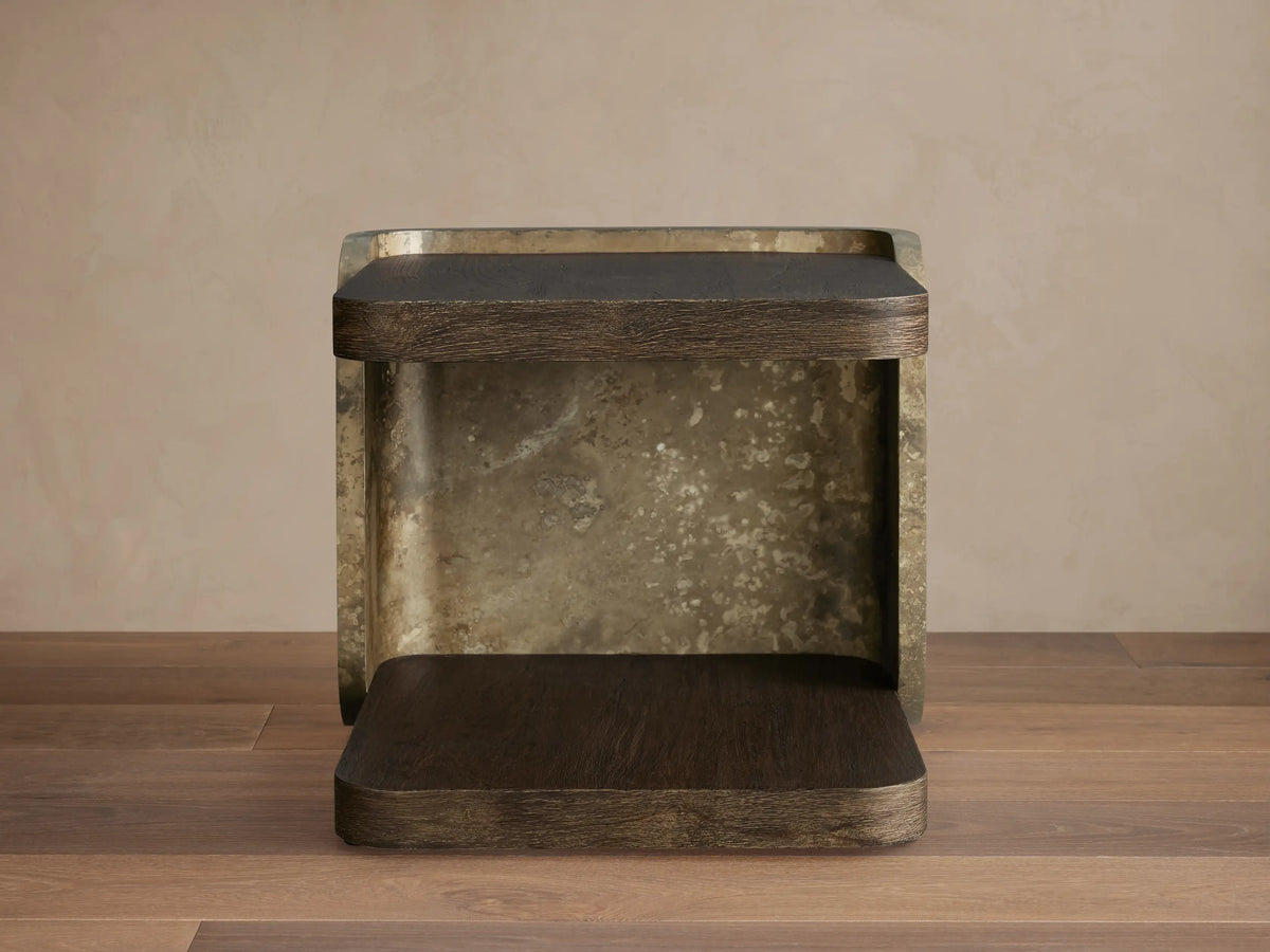 Alvaro End Table: dark brown spalted wood top/base, weathered aluminum sides with mottled gold patina. Front view.