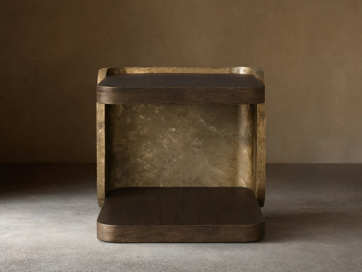Alvaro End Table: dark brown spalted wood top/base, weathered aluminum sides with mottled gold patina. Front view.