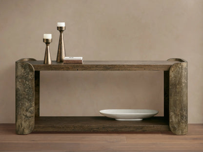 Alvaro Console Table: two dark spalted primavera wood shelves, curved weathered aluminum sides with patina. Candlesticks, white bowl.