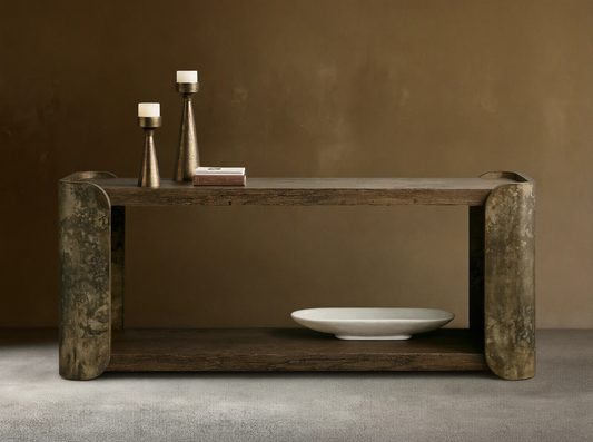 Alvaro Console Table: two dark spalted primavera wood shelves, curved weathered aluminum sides with patina. Candlesticks, white bowl.