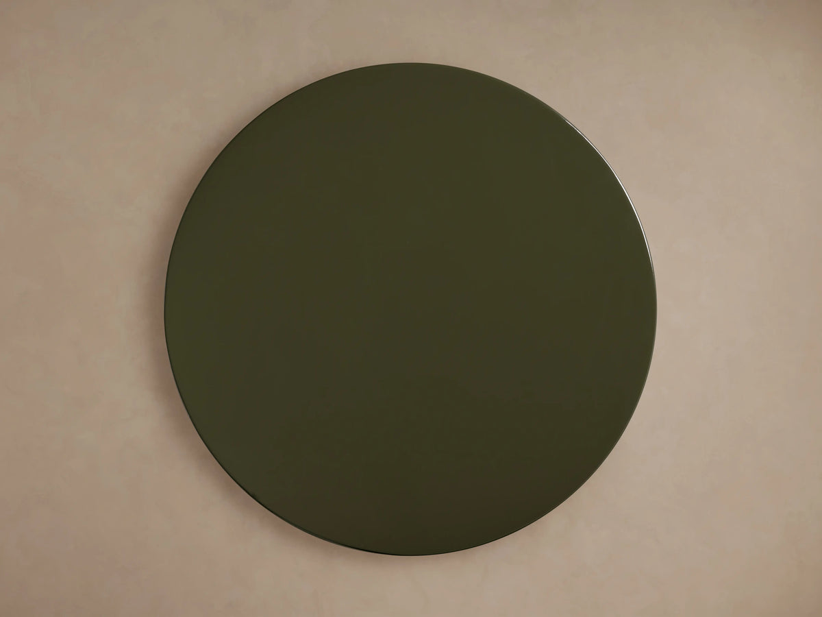 Close-up of the Alwyn Lacquer Stool, showing its glossy, dark green finish with sleek, smooth curves reflecting light.