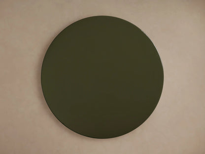Close-up of the Alwyn Lacquer Stool, showing its glossy, dark green finish with sleek, smooth curves reflecting light.