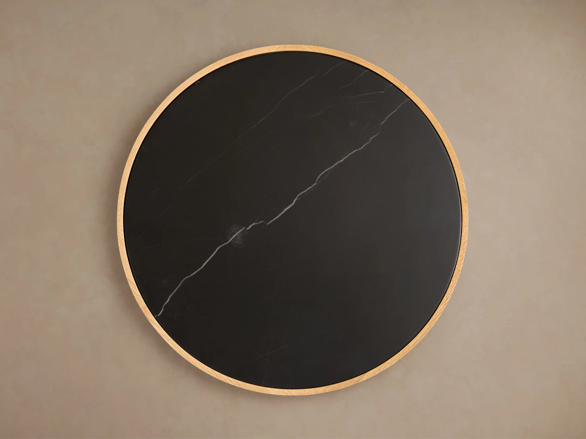 Astor Round End Table with natural marble stone top in black, featuring a light wood base wrapped in solid oak reeds.
