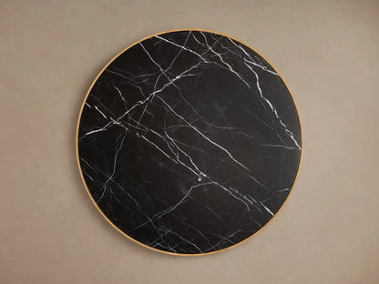 Astor Round Coffee Table with a black marble top featuring white veining, supported by a textured oak reed-wrapped base.