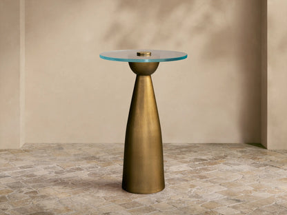 Front view of the Antique Brass Beaufort Glass Top Martini Table, featuring a round glass top and tapered base.